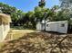 Large backyard with storage shed and mature trees at 111 S Delaware Ave, Deland, FL 32720