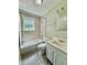 Bathroom featuring tiled walls, sink, toilet, bathtub, and shower at 111 S Delaware Ave, Deland, FL 32720