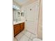 Bathroom with tiled flooring features a vanity with a sink at 111 S Delaware Ave, Deland, FL 32720