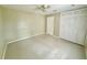 Bedroom featuring closet, ceiling fan, and tile flooring at 111 S Delaware Ave, Deland, FL 32720