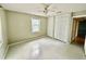 Bedroom featuring large closets, ceiling fan, and view into the hallway at 111 S Delaware Ave, Deland, FL 32720