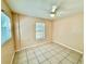 Bedroom features natural light from two windows and a ceiling fan at 111 S Delaware Ave, Deland, FL 32720