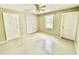 Empty bedroom featuring neutral colored walls, two entry doors, and one closet door at 111 S Delaware Ave, Deland, FL 32720