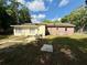 Rear view of home featuring both brick and siding at 111 S Delaware Ave, Deland, FL 32720