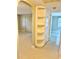Hallway featuring built-in shelving and access to additional rooms at 111 S Delaware Ave, Deland, FL 32720