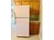 White refrigerator with wood cabinets and countertops nearby in the kitchen at 111 S Delaware Ave, Deland, FL 32720