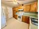 Traditional kitchen with light wood cabinets, countertops, and a full set of appliances at 111 S Delaware Ave, Deland, FL 32720