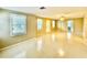 Living room with lots of light, tile flooring and view into other areas of home at 111 S Delaware Ave, Deland, FL 32720