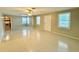 Spacious living room featuring tile floors and multiple windows for natural light at 111 S Delaware Ave, Deland, FL 32720