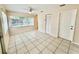 Inviting living area is flooded with natural light from large windows at 111 S Delaware Ave, Deland, FL 32720