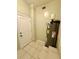 A small room showcases the water heater and access to a door at 111 S Delaware Ave, Deland, FL 32720