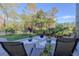 Tranquil backyard area with a paved patio and lush greenery, perfect for outdoor relaxation at 1117 Oxbridge Ln, Ormond Beach, FL 32174