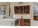 Stylish bar area with wine storage, custom cabinetry, and elegant design at 1117 Oxbridge Ln, Ormond Beach, FL 32174
