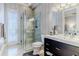 Modern bathroom with glass shower, sleek vanity, and tile flooring at 1117 Oxbridge Ln, Ormond Beach, FL 32174