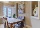 Bright dining room with French doors leading to outdoor patio at 1117 Oxbridge Ln, Ormond Beach, FL 32174