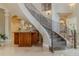 Elegant foyer featuring a grand staircase and marble flooring at 1117 Oxbridge Ln, Ormond Beach, FL 32174