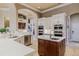 Gourmet kitchen with a center island, stainless steel appliances, and custom cabinetry at 1117 Oxbridge Ln, Ormond Beach, FL 32174
