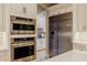 Gourmet kitchen featuring stainless steel appliances and custom white cabinetry at 1117 Oxbridge Ln, Ormond Beach, FL 32174
