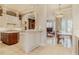 Open-concept kitchen with island, stainless steel appliances, and breakfast nook at 1117 Oxbridge Ln, Ormond Beach, FL 32174