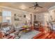 Cozy living room featuring hardwood floors, comfortable seating, and tasteful decor at 1117 Oxbridge Ln, Ormond Beach, FL 32174