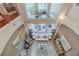 Open living room with soaring ceilings and backyard view at 1117 Oxbridge Ln, Ormond Beach, FL 32174