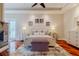 Spacious main bedroom with fireplace, decor, and hardwood floors at 1117 Oxbridge Ln, Ormond Beach, FL 32174