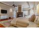 Comfortable main bedroom with sitting area and cozy fireplace at 1117 Oxbridge Ln, Ormond Beach, FL 32174