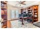 Well-appointed office with built-in shelving and natural light at 1117 Oxbridge Ln, Ormond Beach, FL 32174