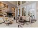 Inviting outdoor kitchen area with grill, seating, and views of the backyard at 1117 Oxbridge Ln, Ormond Beach, FL 32174