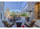 Back patio with seating area and outdoor kitchen at 1117 Oxbridge Ln, Ormond Beach, FL 32174