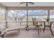 Inviting outdoor patio with tile flooring, ceiling fan and furniture at 1117 Oxbridge Ln, Ormond Beach, FL 32174