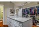 Walk-in closet with island and extensive shelving at 1117 Oxbridge Ln, Ormond Beach, FL 32174