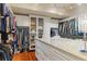 Custom walk-in closet with large island and custom storage at 1117 Oxbridge Ln, Ormond Beach, FL 32174
