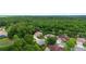 Beautiful aerial shot of suburban homes nestled among mature trees in a well-kept neighborhood at 115 San Marino Ln, Deland, FL 32724