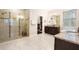 Bright bathroom featuring a walk-in shower, granite countertops and a walk-in closet at 115 San Marino Ln, Deland, FL 32724