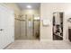 Bathroom showcasing a walk-in shower and access to the walk-in closet at 115 San Marino Ln, Deland, FL 32724