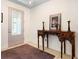 Elegant entryway featuring a decorative glass door, tile flooring, and a stylish console table at 115 San Marino Ln, Deland, FL 32724