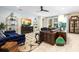 Comfortable living room with large sofas, stylish decor, and a ceiling fan for added comfort at 115 San Marino Ln, Deland, FL 32724