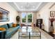Comfortable living room featuring modern decor, recessed lighting, and a large window view at 115 San Marino Ln, Deland, FL 32724