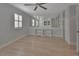 Bright bedroom features ample closet space, natural light, and light wood flooring at 117 N Garfield Ave # 16, Deland, FL 32724
