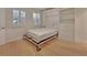 Neutral bedroom features hardwood floors, multiple windows and a wall bed is currently open at 117 N Garfield Ave # 16, Deland, FL 32724
