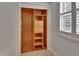 This wood closet features shelving, drawers, and clothing rods for optimal storage space at 117 N Garfield Ave # 16, Deland, FL 32724