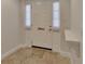 Bright entryway featuring a white door with elegant molding and tile flooring at 117 N Garfield Ave # 16, Deland, FL 32724