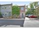 Charming brick townhome features a well-maintained facade, inviting entrance, and convenient parking for residents and guests at 117 N Garfield Ave # 16, Deland, FL 32724
