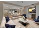 Open-concept living room with modern furnishings, a dining area, and stylish decor at 117 N Garfield Ave # 16, Deland, FL 32724