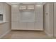 Contemporary living room with sleek built-in storage and display shelving at 117 N Garfield Ave # 16, Deland, FL 32724
