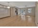 Bright living room featuring light wood flooring, recessed lighting, and French doors to the patio at 117 N Garfield Ave # 16, Deland, FL 32724