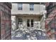 Private brick-walled patio offers a secluded outdoor space, perfect for relaxation and quiet enjoyment of the surrounding scenery at 117 N Garfield Ave # 16, Deland, FL 32724
