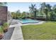 Inviting in-ground pool is surrounded by lush landscaping, perfect for cooling off and enjoying the outdoors at 117 N Garfield Ave # 16, Deland, FL 32724