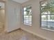Bright room with two windows and storage cabinets with white doors and silver handles at 117 N Garfield Ave # 16, Deland, FL 32724